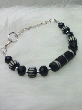 Beautiful handmade bracelet with engraved elk bone beads, crystals & beads
